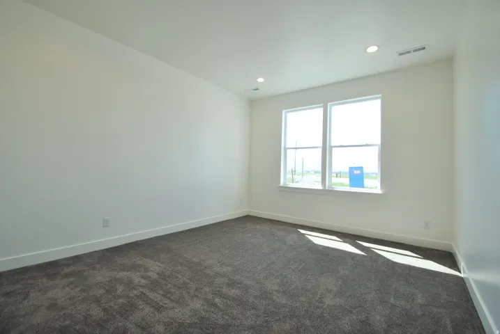 Bedroom with Recessed lighting, dual windows, gray carpet, and white walls