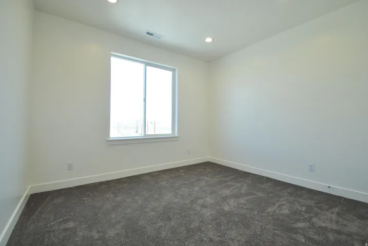 Bedroom with Recessed lighting, dual windows, gray carpet, and white walls