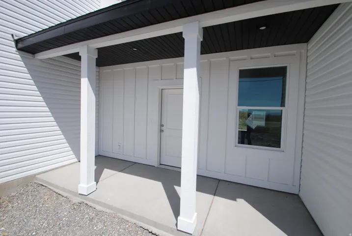 White exterior siding with board and batten accents