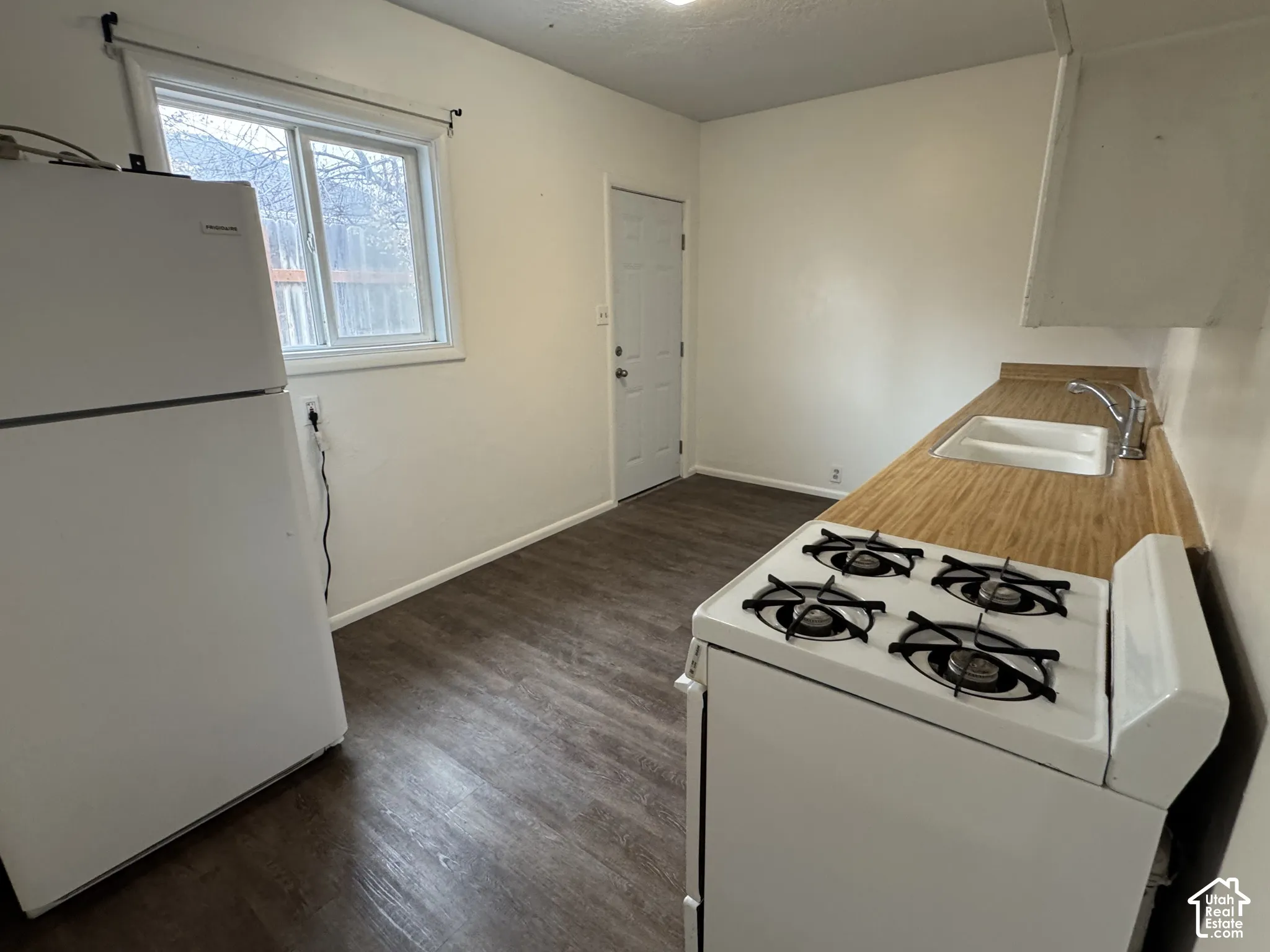Wood-finish flooring with white walls