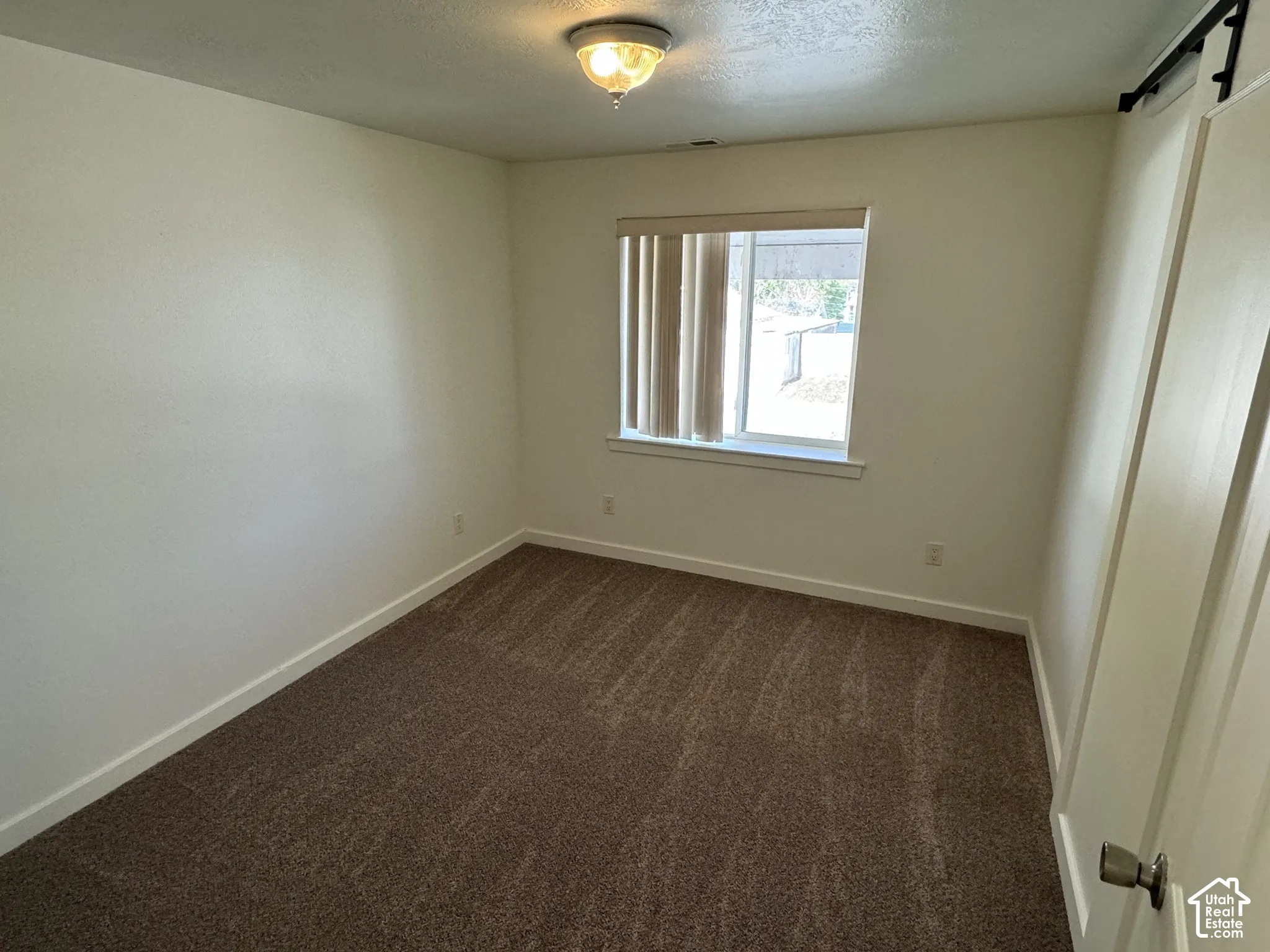 Neutral-toned walls with coordinating carpeting
