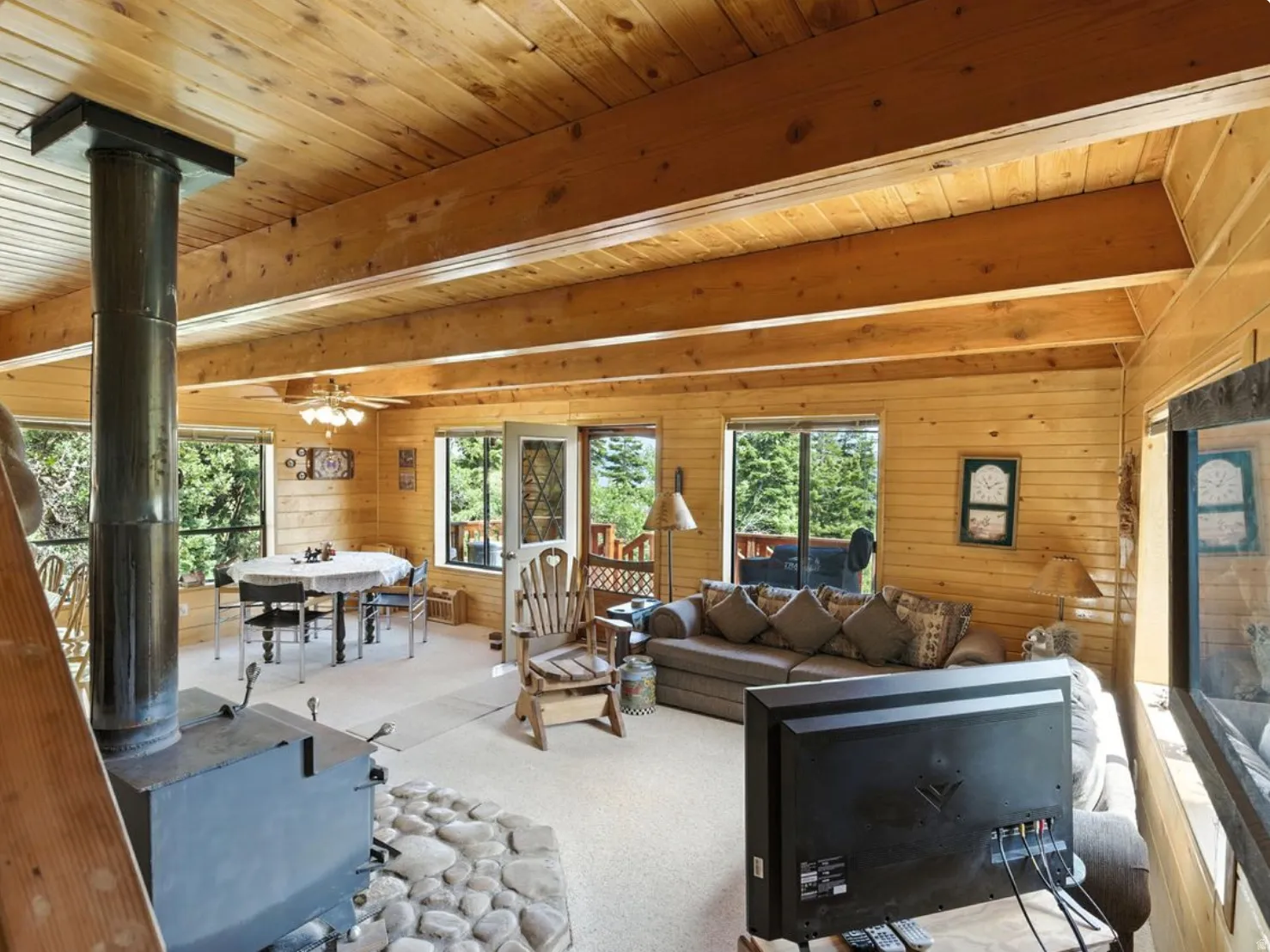 Wood-paneled walls and ceiling with exposed beams