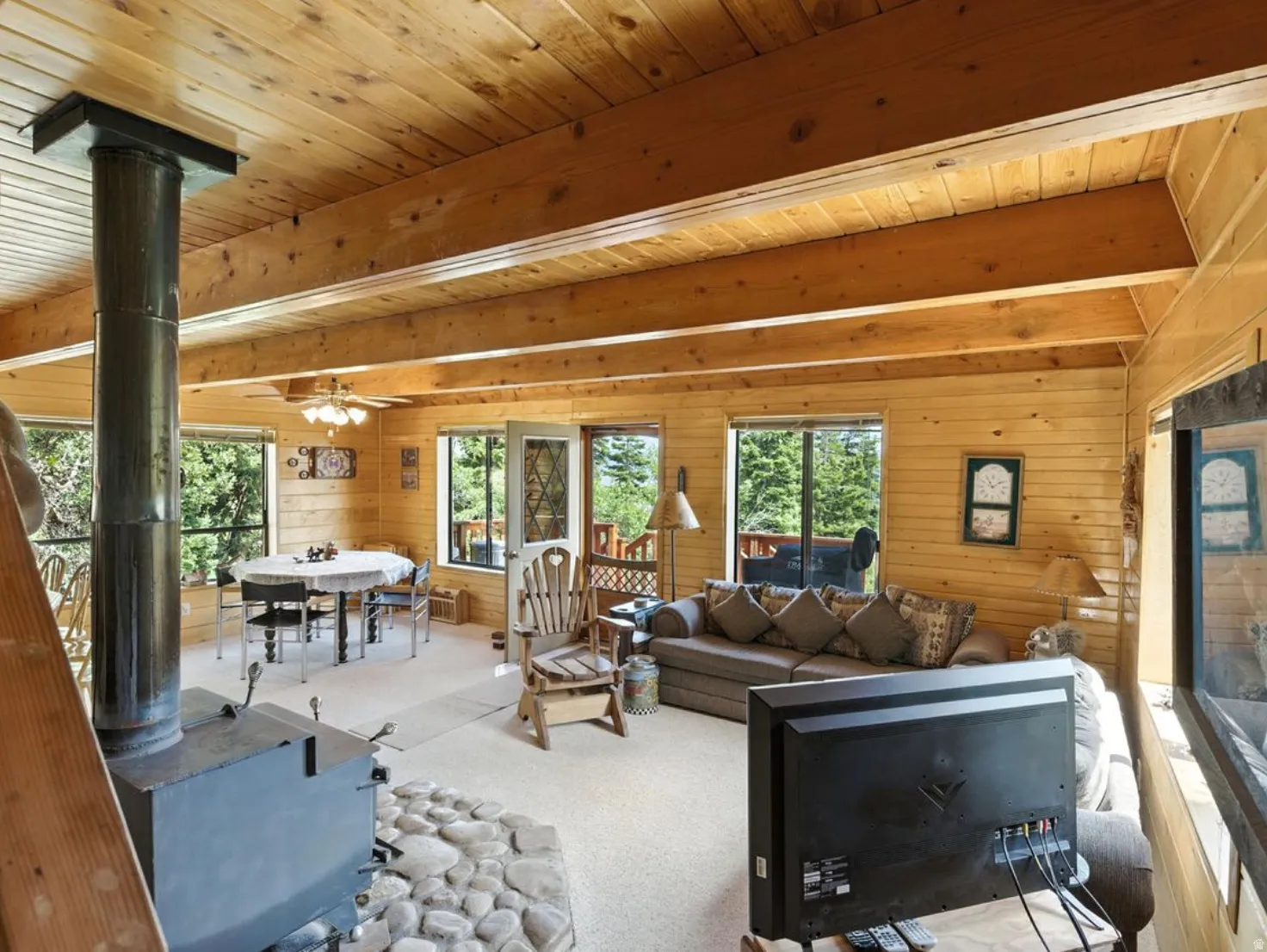 Wood plank walls and ceiling with exposed wood beams