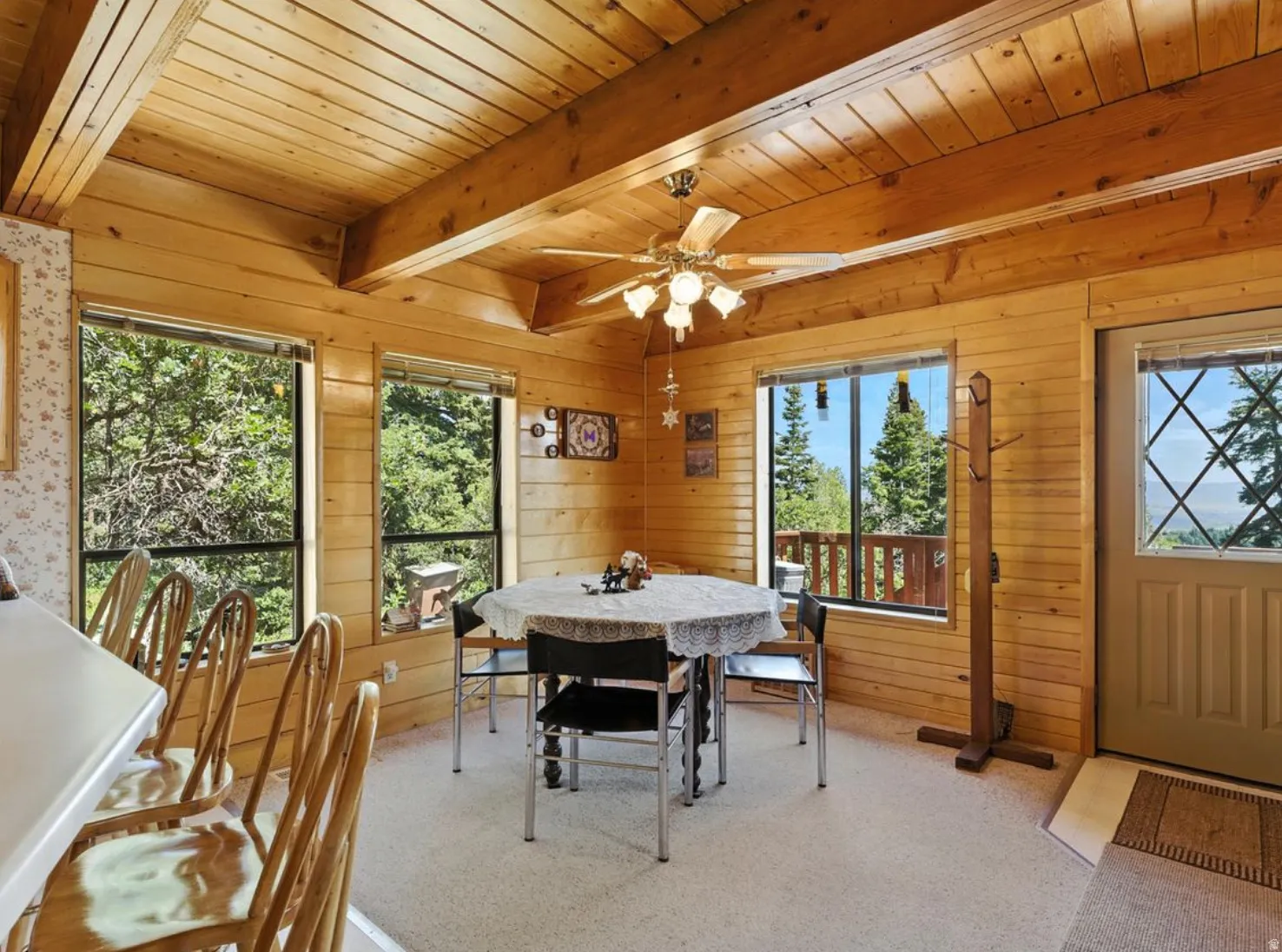 Wood-paneled walls and ceiling with exposed beams