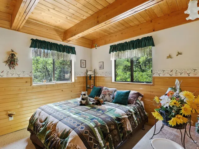 Wood-paneled walls and exposed ceiling beams