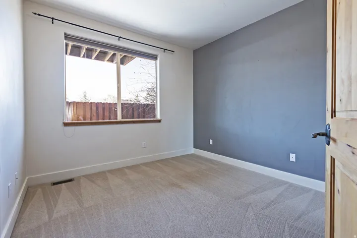 Carpeted interior with a neutral color palette