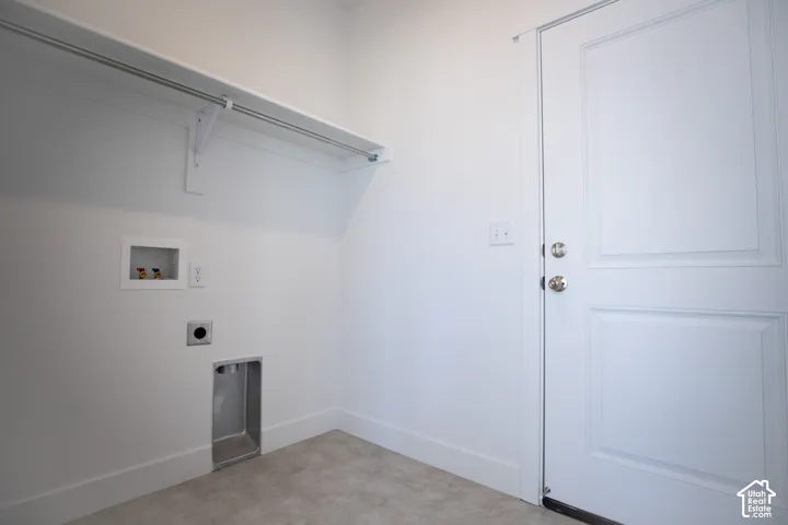 Full-size, dedicated laundry room with washer/dryer hookups adjacent to garage.