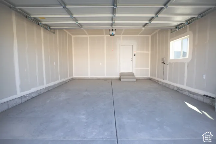 Two-car garage with taped finish.