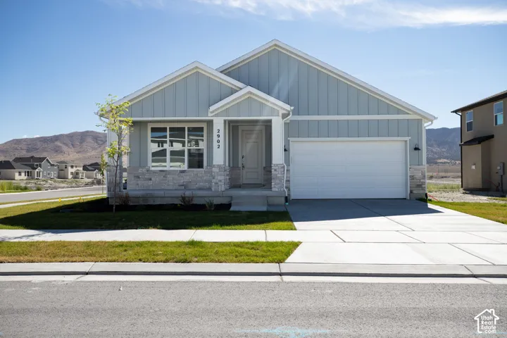 Granite Elevation C with extended front porch and front and side yard landscaping installed.