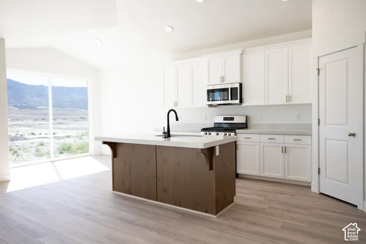 Open dining area with 8' sliding glass door adjacent to kitchen.