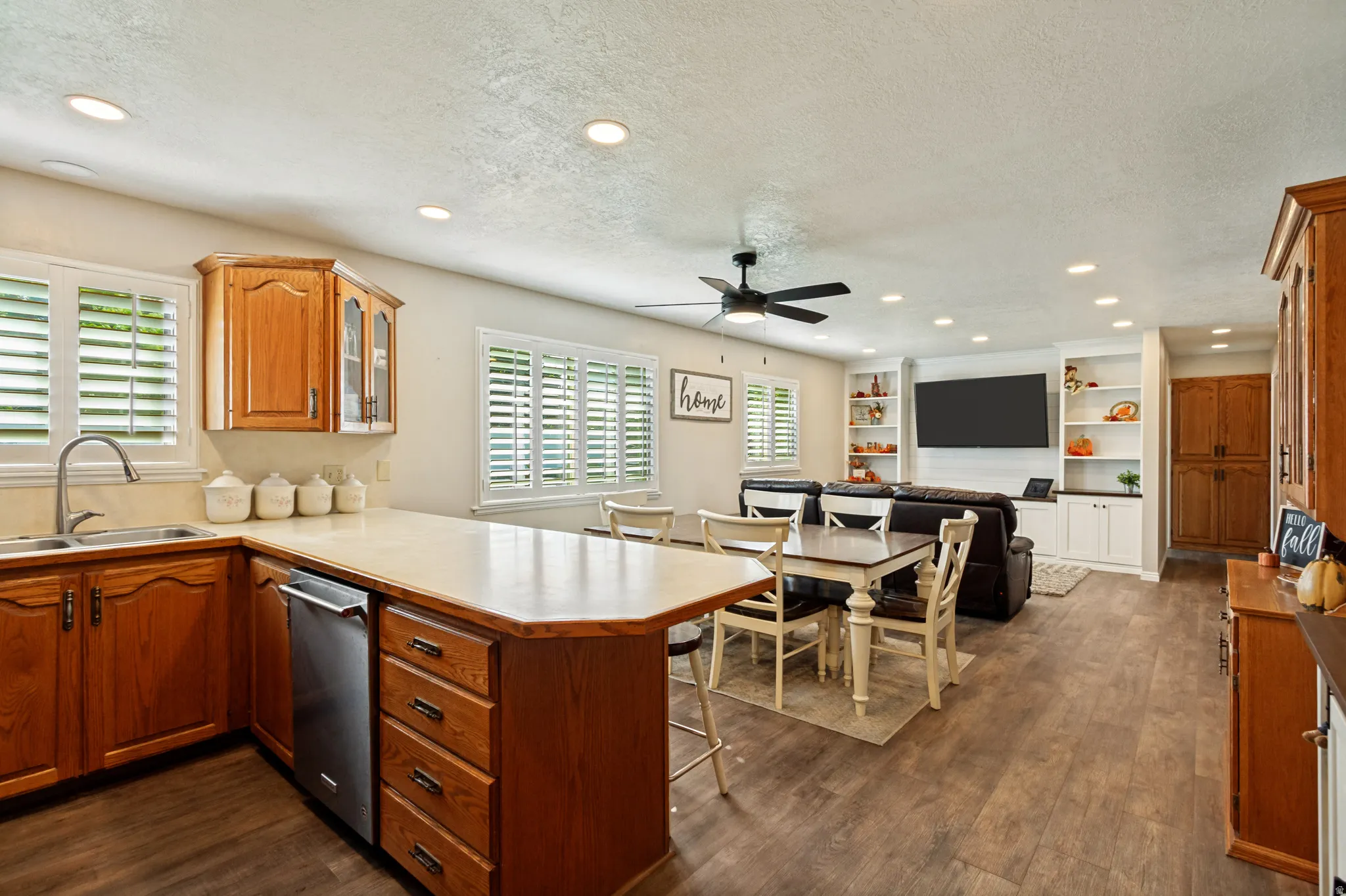 Open-concept living area with wood-finish flooring