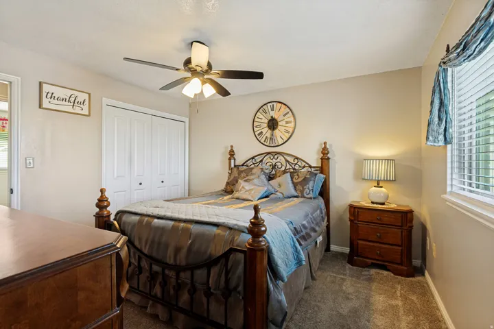 Neutral-toned walls complement the textured carpeting