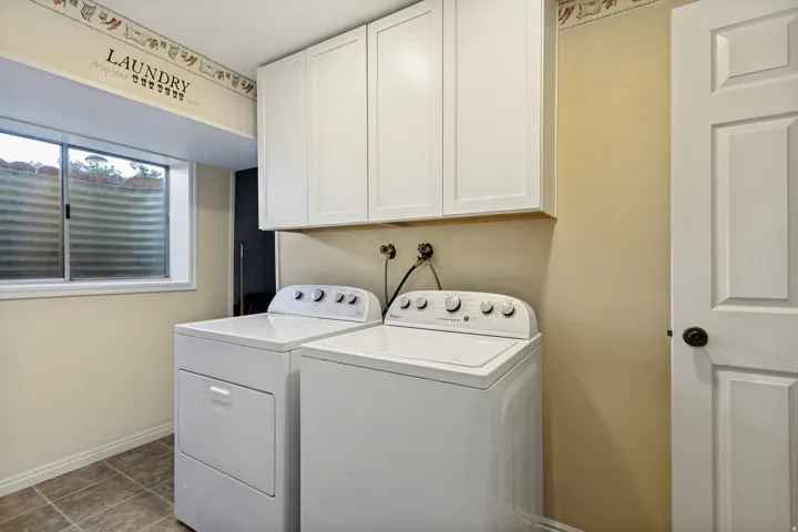 Recessed window, wood-finish flooring, and shaker-style cabinetry
