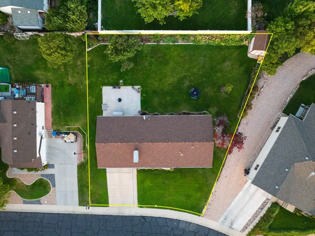 Manicured lawn with mature perimeter trees, providing ample outdoor space