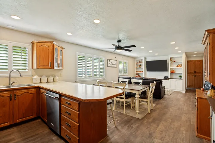 Open-concept living area with wood-finish flooring