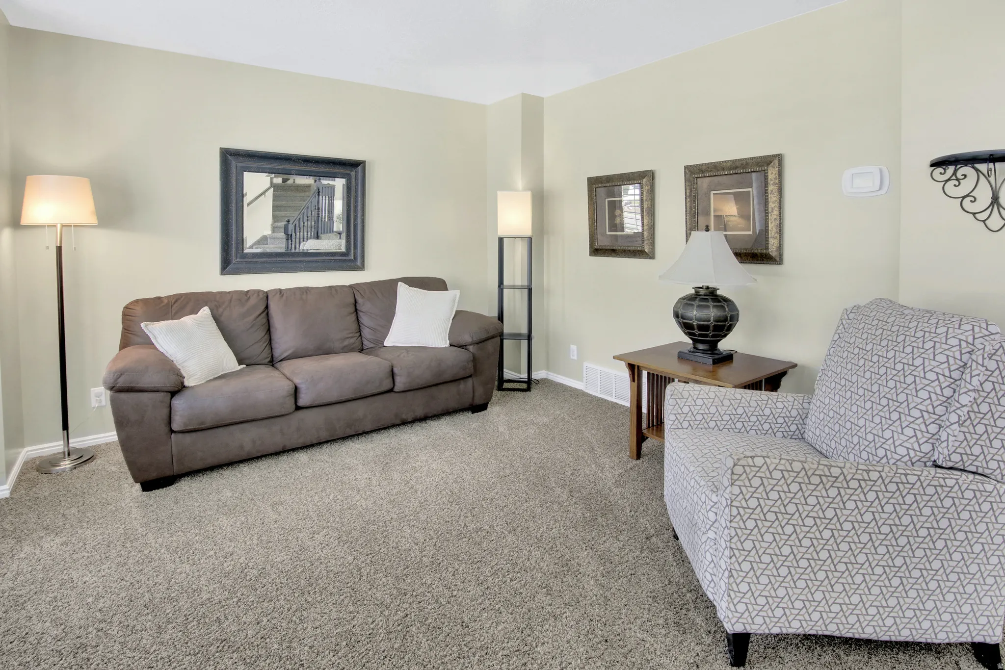 Carpeted flooring, light-toned wall paint, and white trim