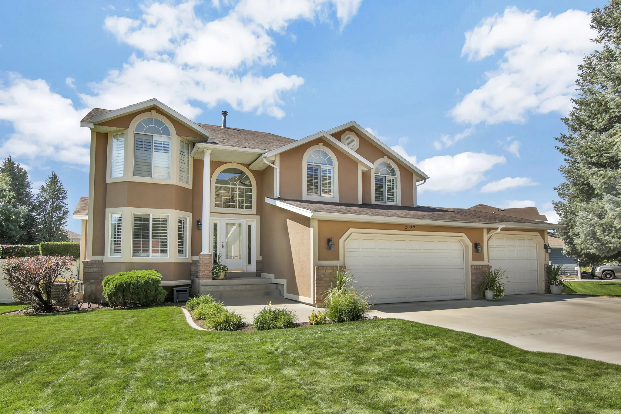 Classy home with Stucco, brick and vinyl exterior. Manicured yard. 3 Car garage. One bay extra deep for trucks!