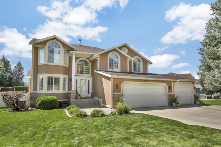 Classy home with Stucco, brick and vinyl exterior. Manicured yard. 3 Car garage. One bay extra deep for trucks!