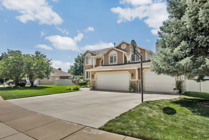 Angle view of home. Wide driveway and extra interior length in 3 Bay garage for TRUCKS!