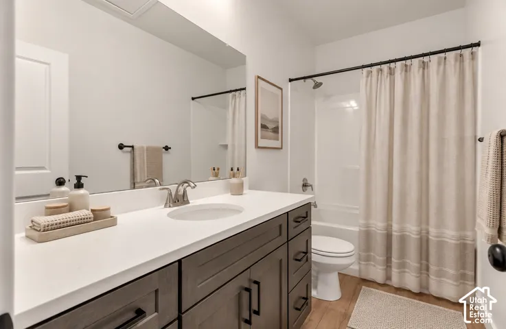 White countertop vanity with dark wood-finish cabinetry