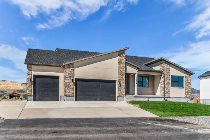 Contemporary exterior with stone accents and stucco siding