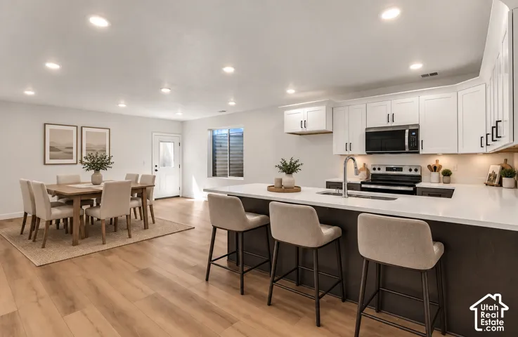 Kitchen ADU Open-concept living space with wood-finish flooring
