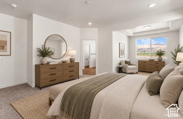 Spacious room with recessed lighting, tray ceiling, large windows, and wall-to-wall carpeting