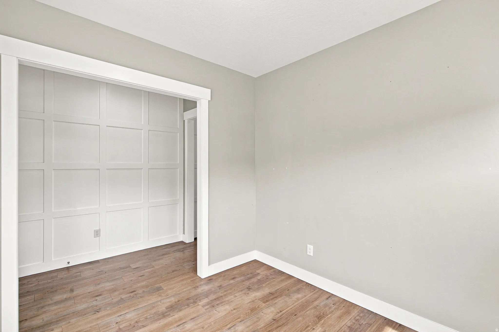 Wood-finish flooring with crisp white trim