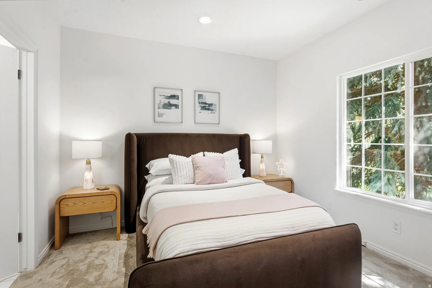 White walls, recessed lighting, and a large window with gridded panes