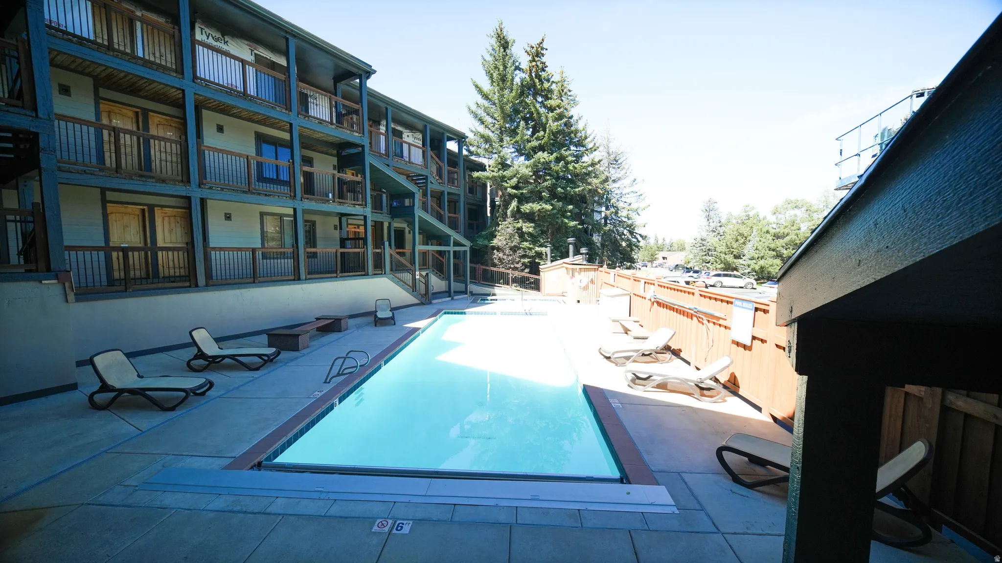 Expansive outdoor swimming pool with surrounding patio