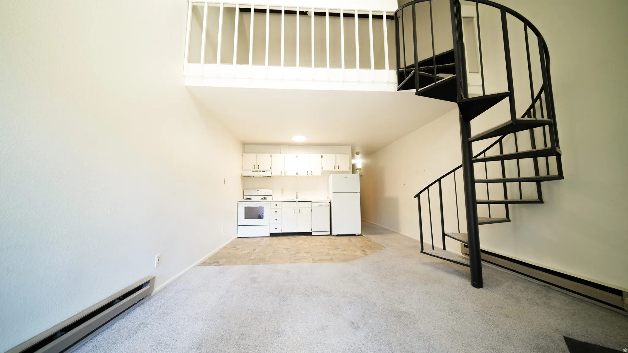 Spiral staircase with black metal railing