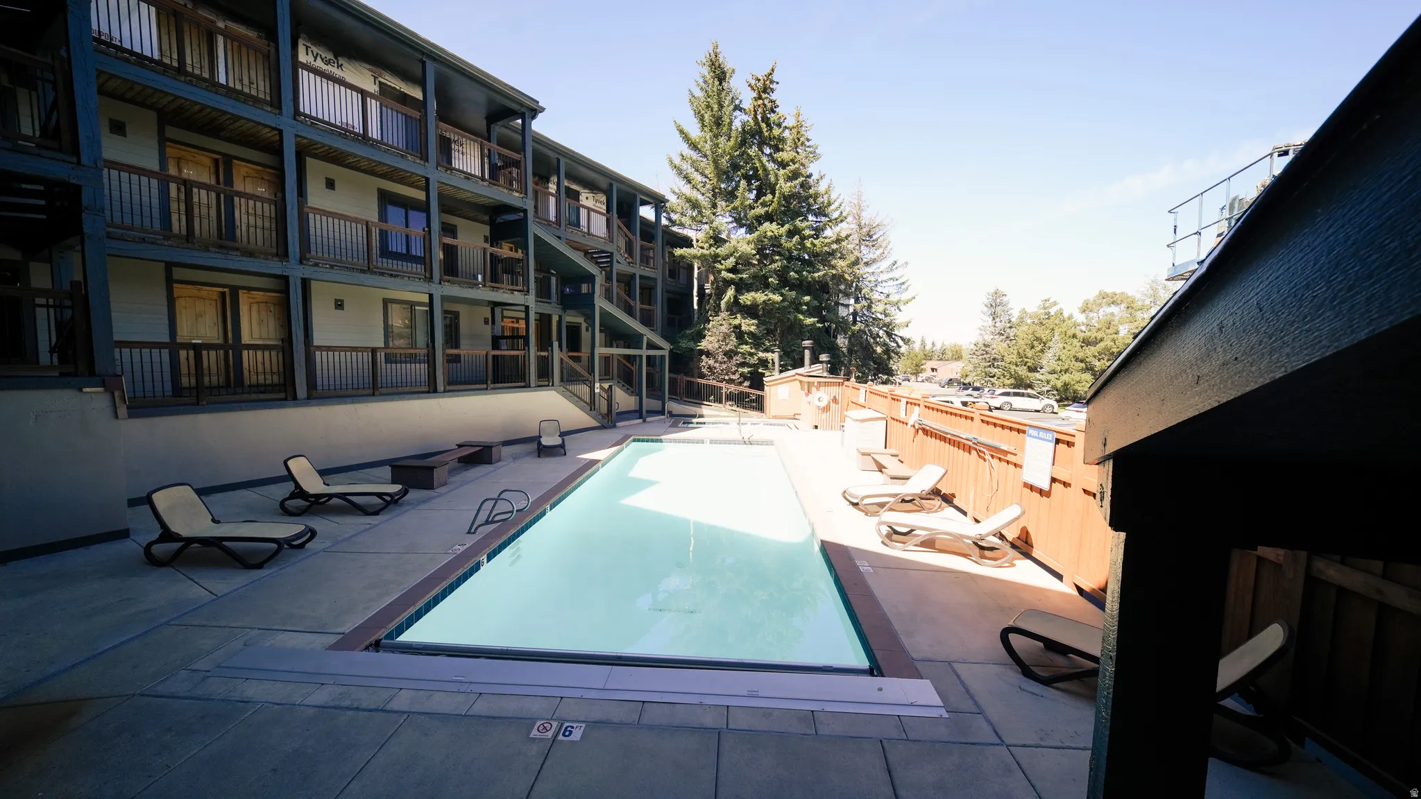 Outdoor swimming pool with concrete surround