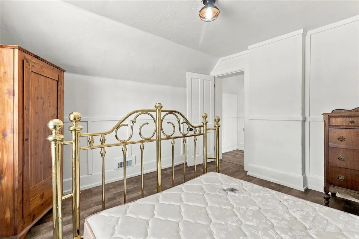White paneling and wood-finish flooring