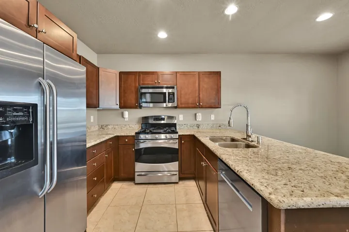 Open Kitchen, dining and living room with access to balcony.