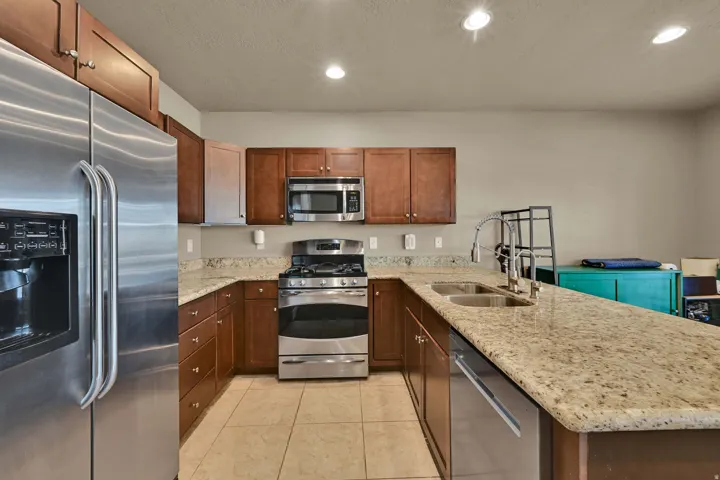 Open Kitchen, dining and living room with access to balcony.