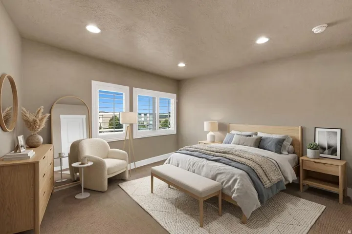 Neutral wall paint, recessed lighting, and carpeted flooring