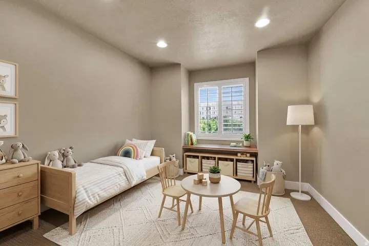 Bedroom #2 with neutral paint and a charming window detail.