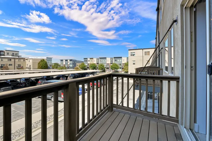 Outdoor balcony with wood-finish decking and railings