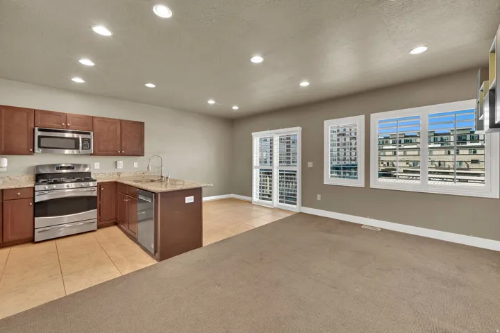 Open Kitchen, dining and living room with access to balcony.