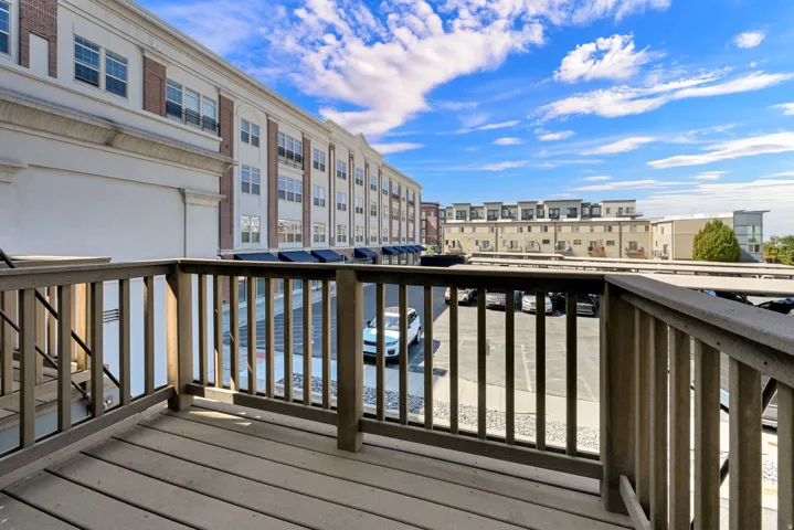 Outdoor balcony with wood-finish decking and railings