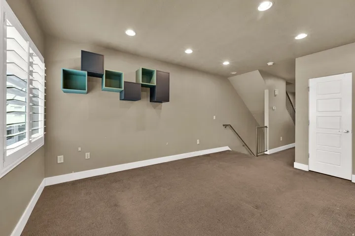 Living room with 2 tone paint, plantation shutters