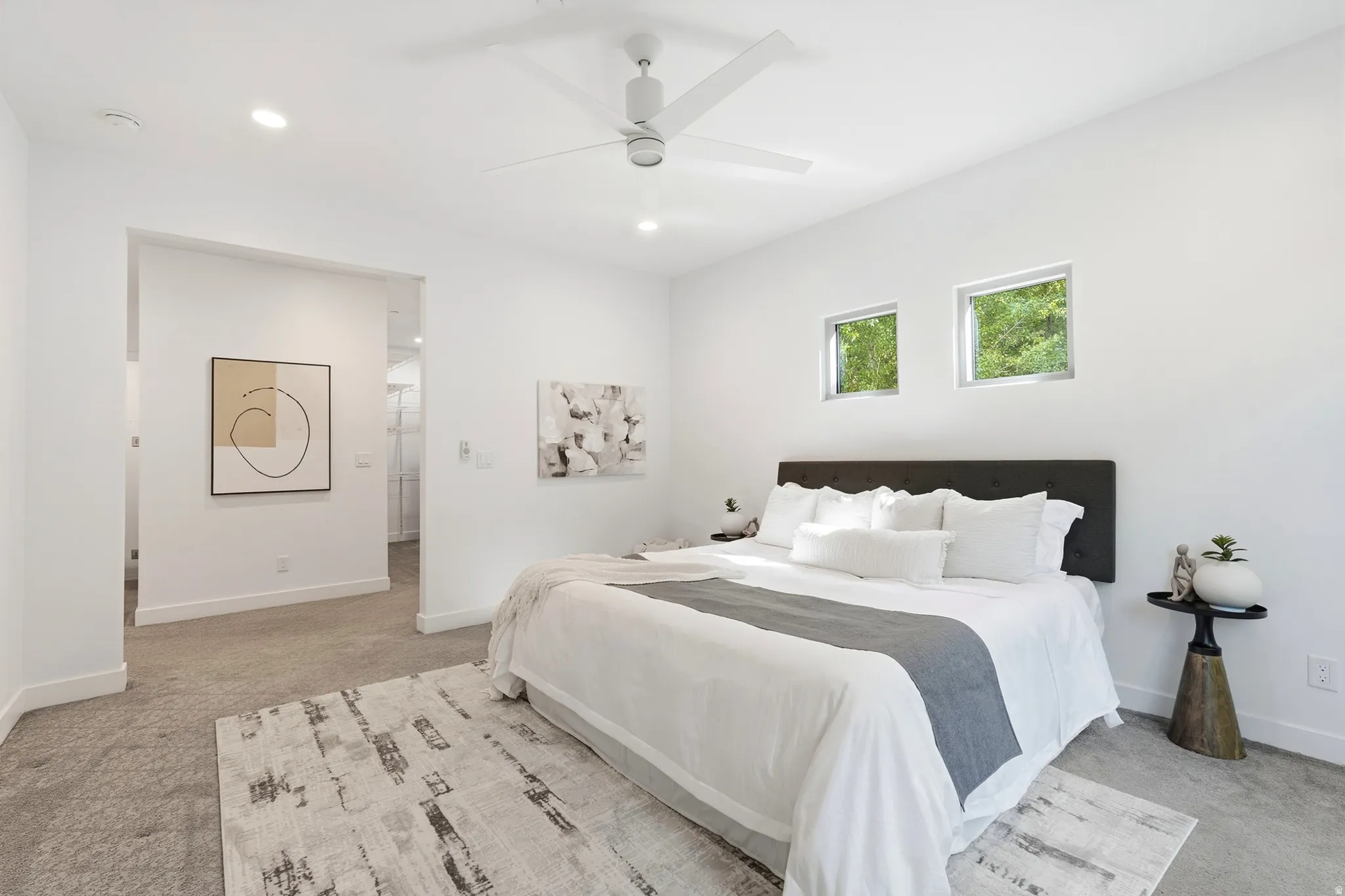 Recessed lighting, ceiling fan, two transom windows, and wall-to-wall carpeting