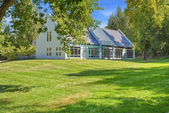 Expansive lawn surrounding a contemporary residence