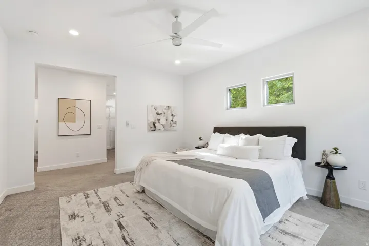 Recessed lighting, ceiling fan, two transom windows, and wall-to-wall carpeting