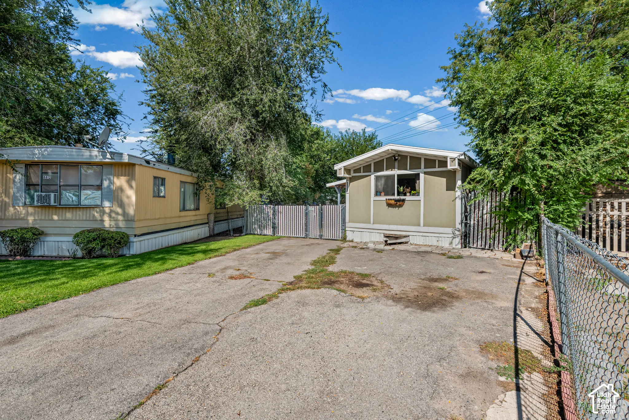 Paved road with fully fenced yard