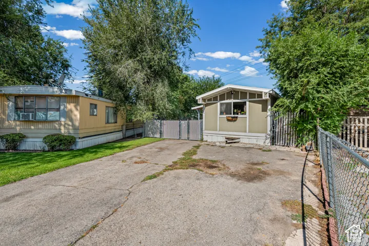 Paved road with fully fenced yard