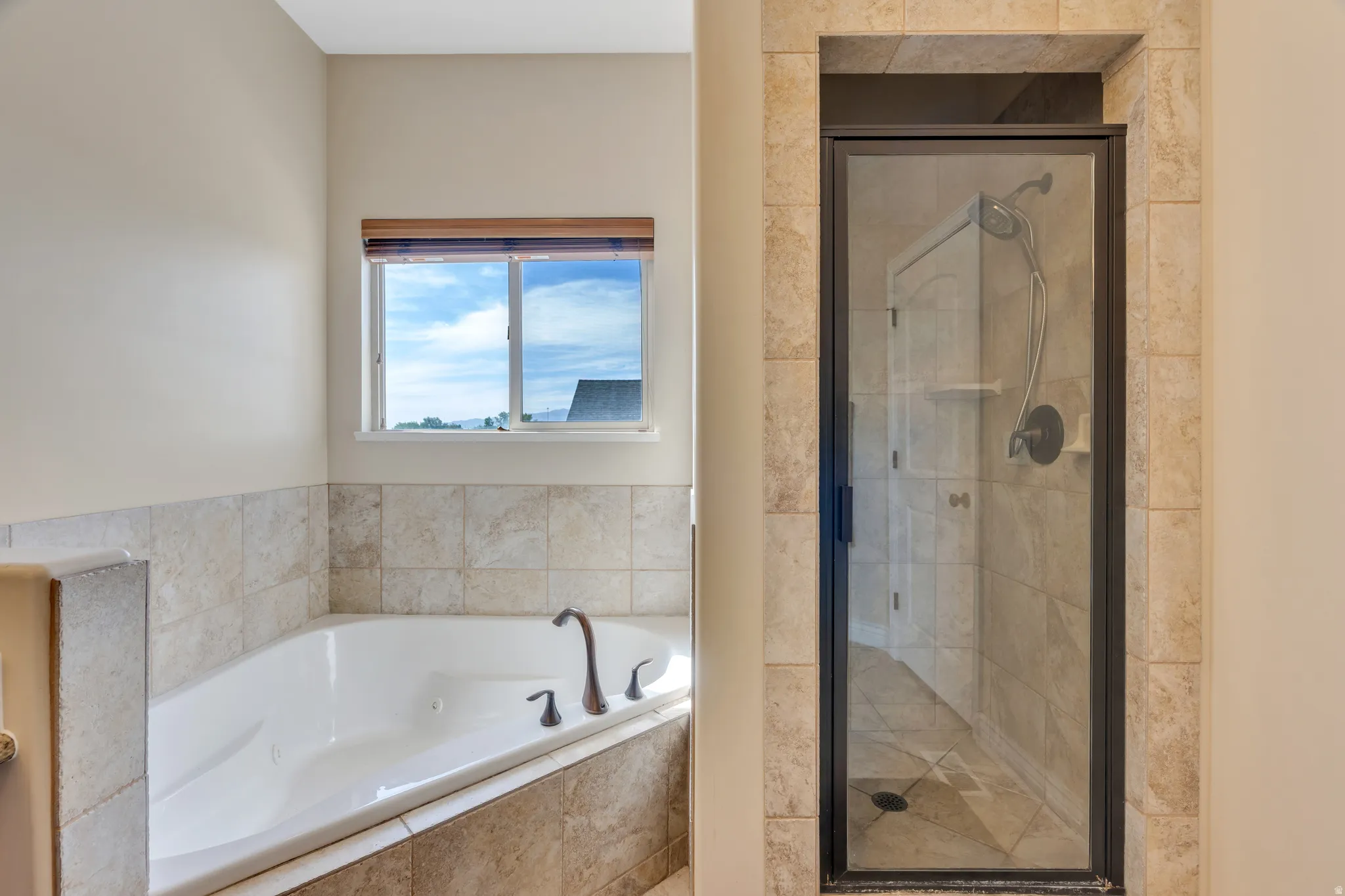 White soaking tub with oil-rubbed bronze fixtures