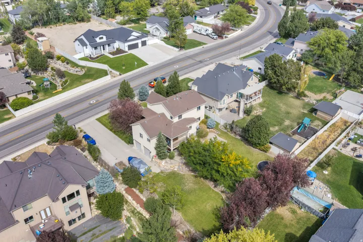 Neighborhood with established residences, mature trees, and paved roadways