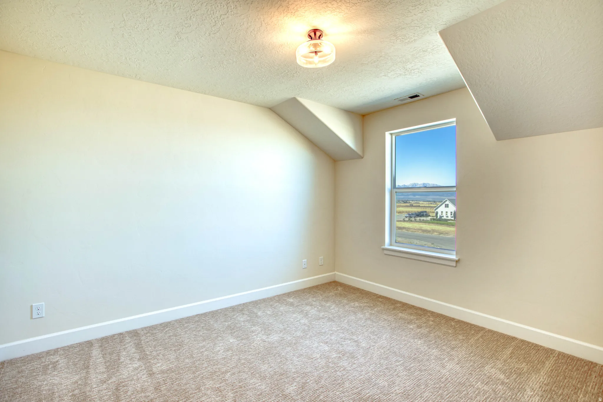 Recessed window with a white frame, neutral carpet flooring, and a semi-flush mount ceiling fixture