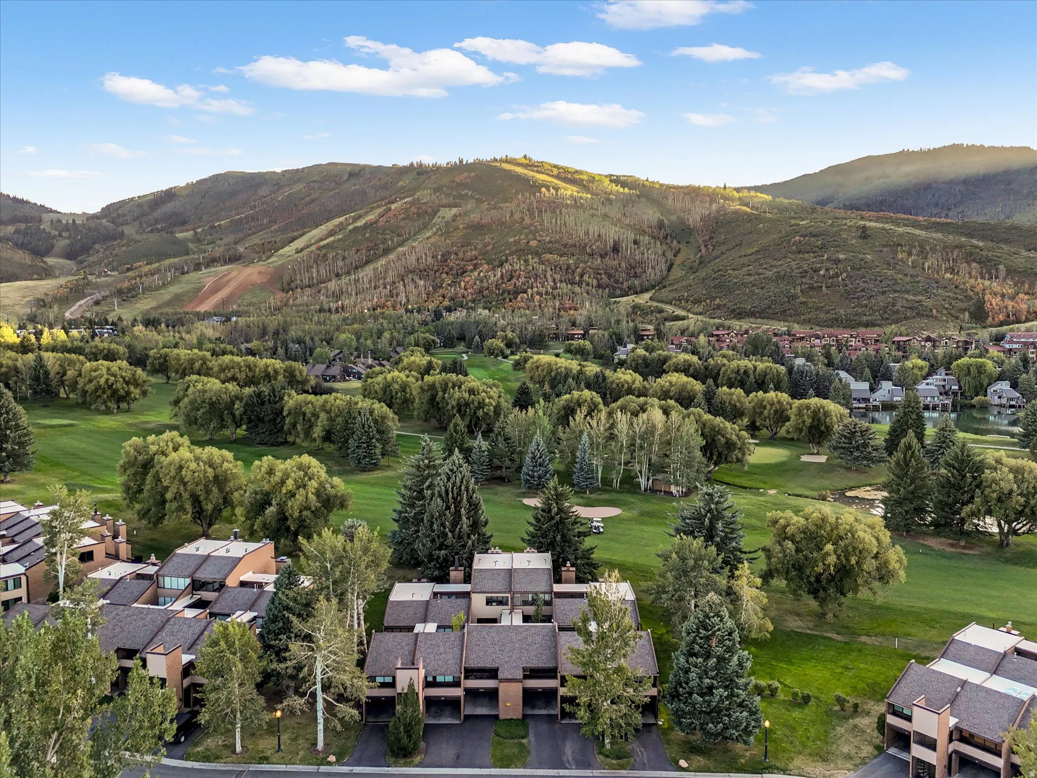 Overhead view of townhome with golf course and mountain views